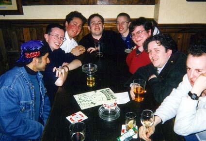 Insomnia players gathered around a table at a 1990s mudmeet
